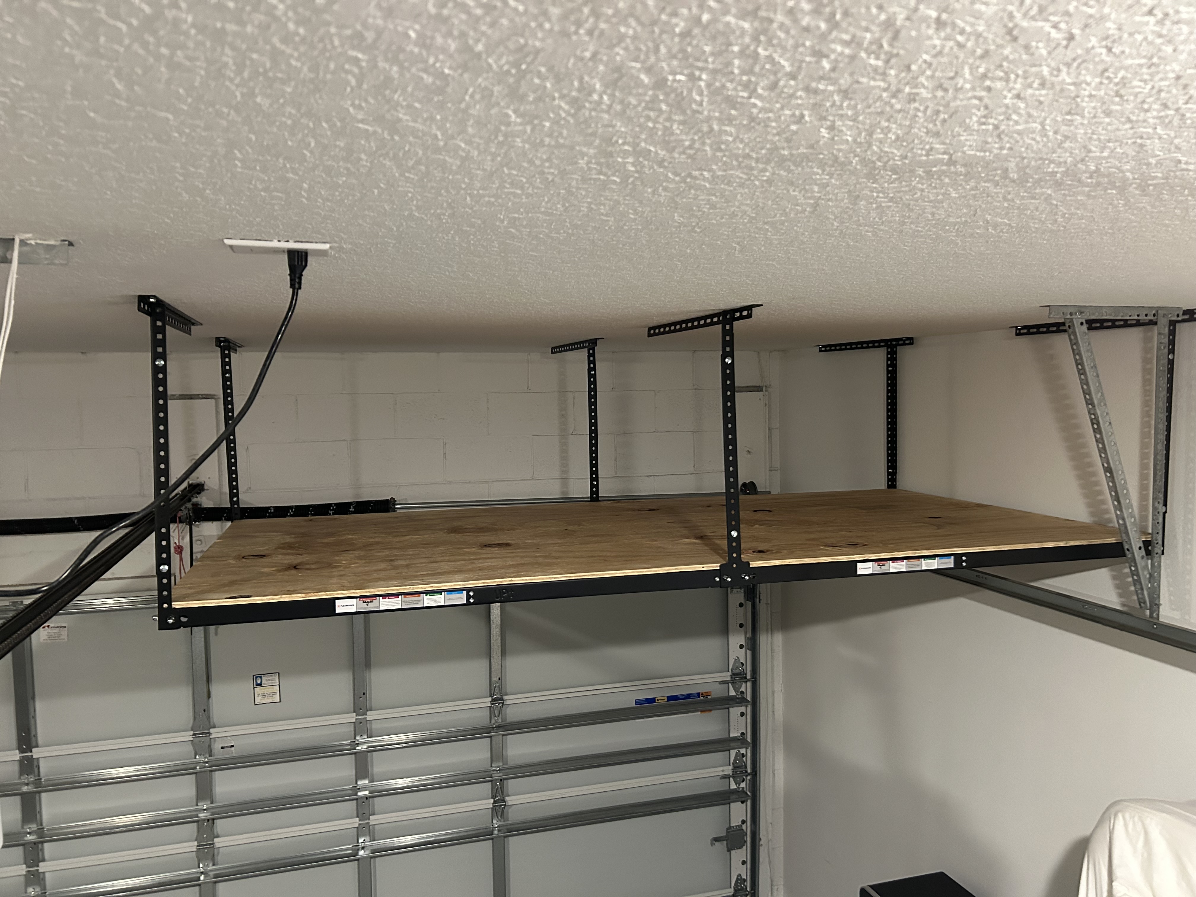 Ceiling mounted hanging shelves in the garage.