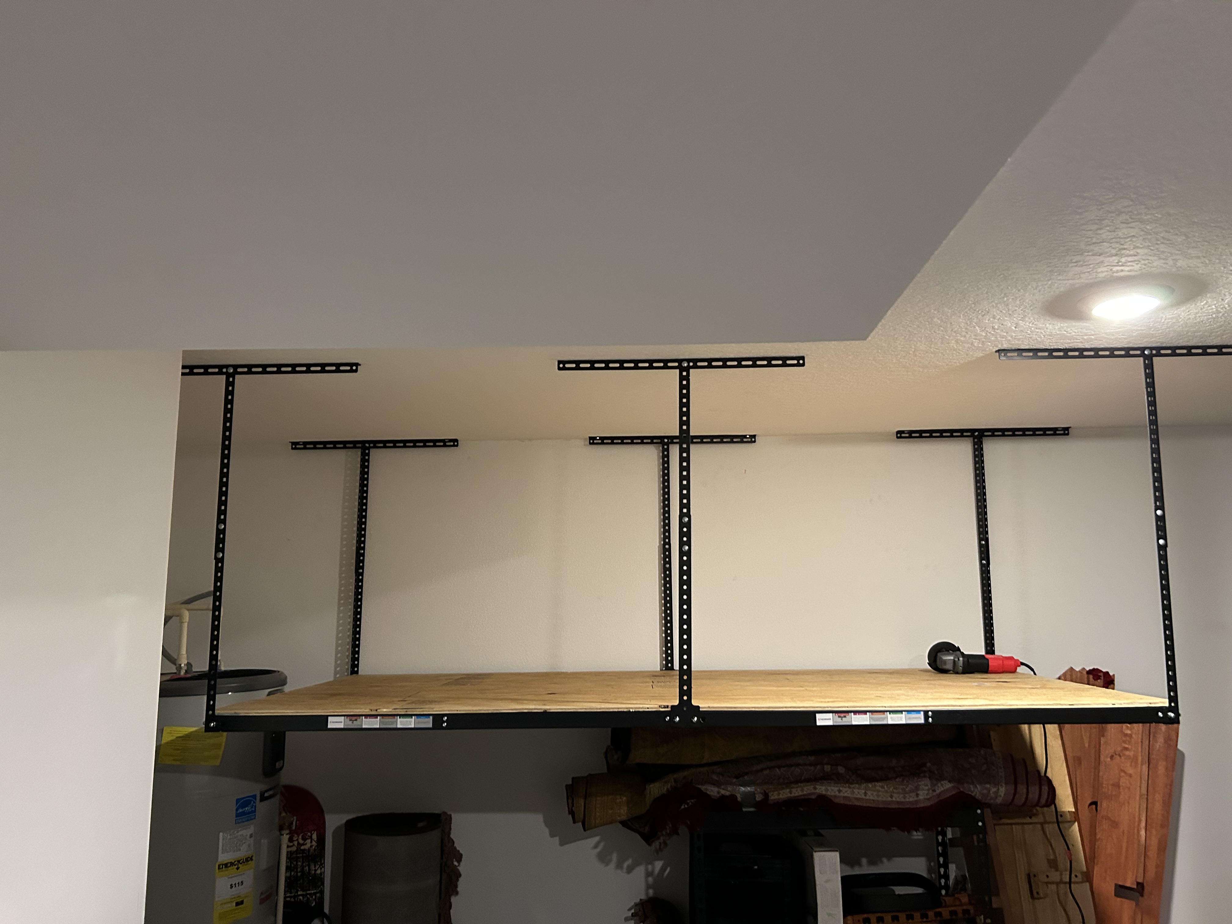 Ceiling mounted hanging shelves in the garage.