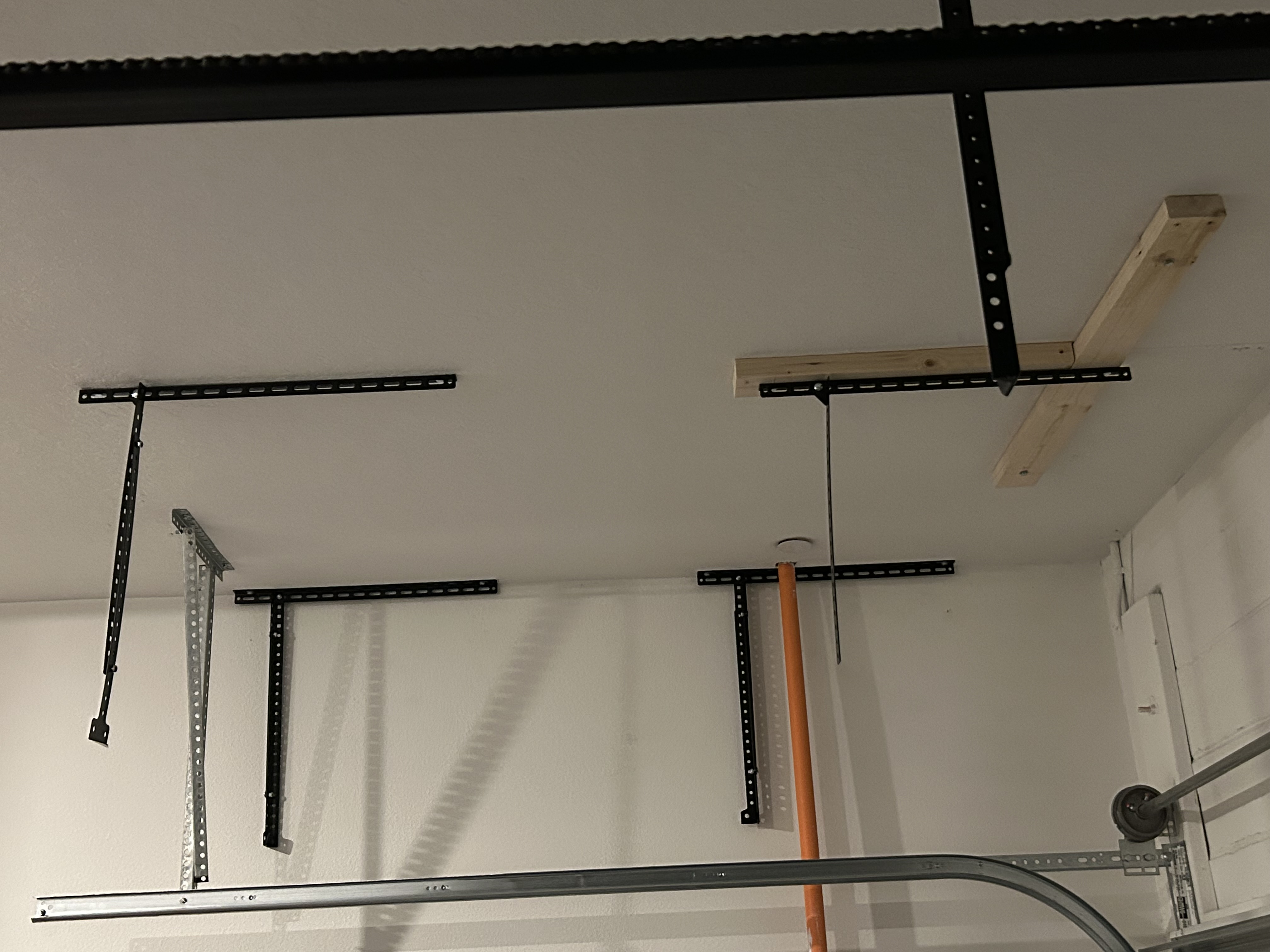 Ceiling mounted hanging shelves in the garage.