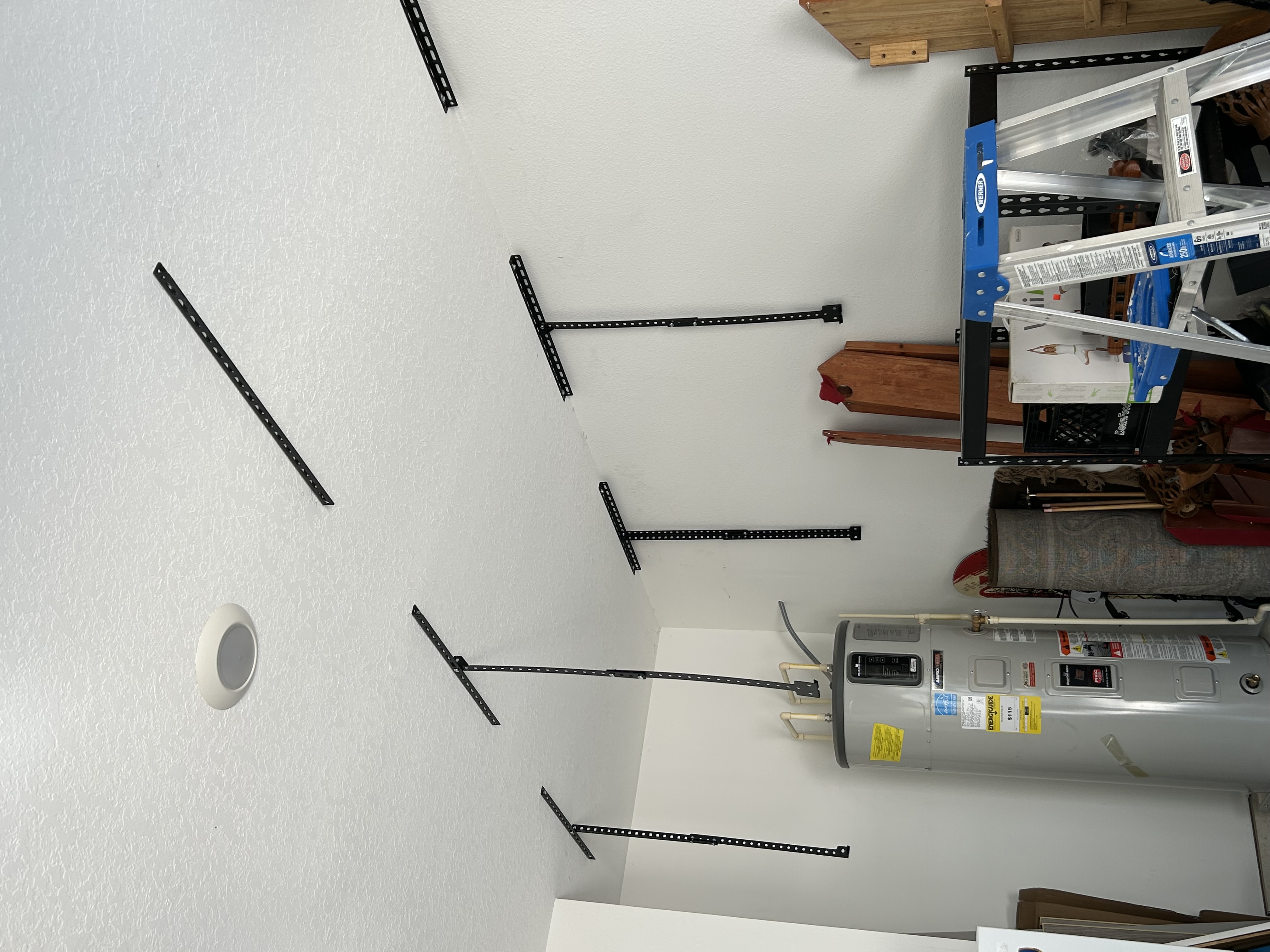 Ceiling mounted hanging shelves in the garage.