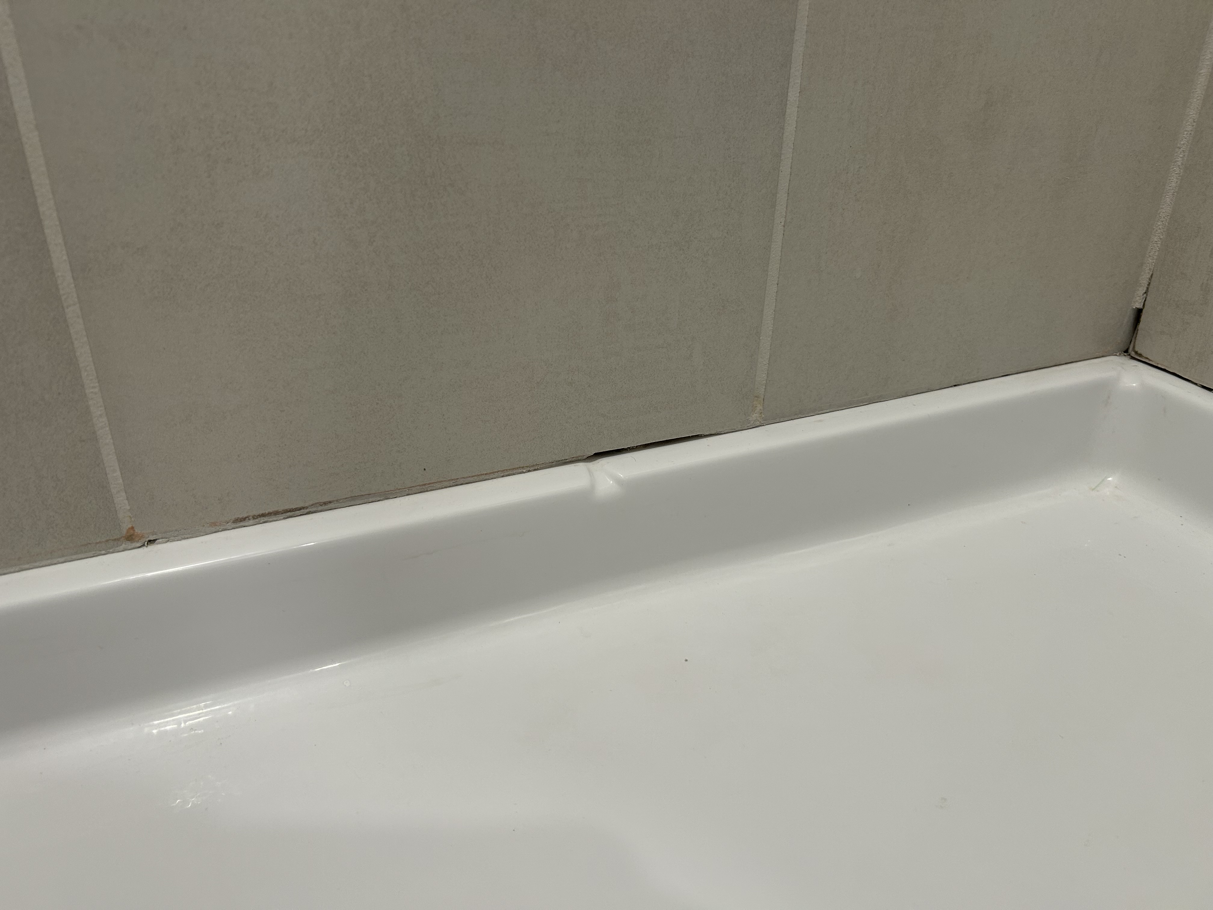 Caulking around shower pan