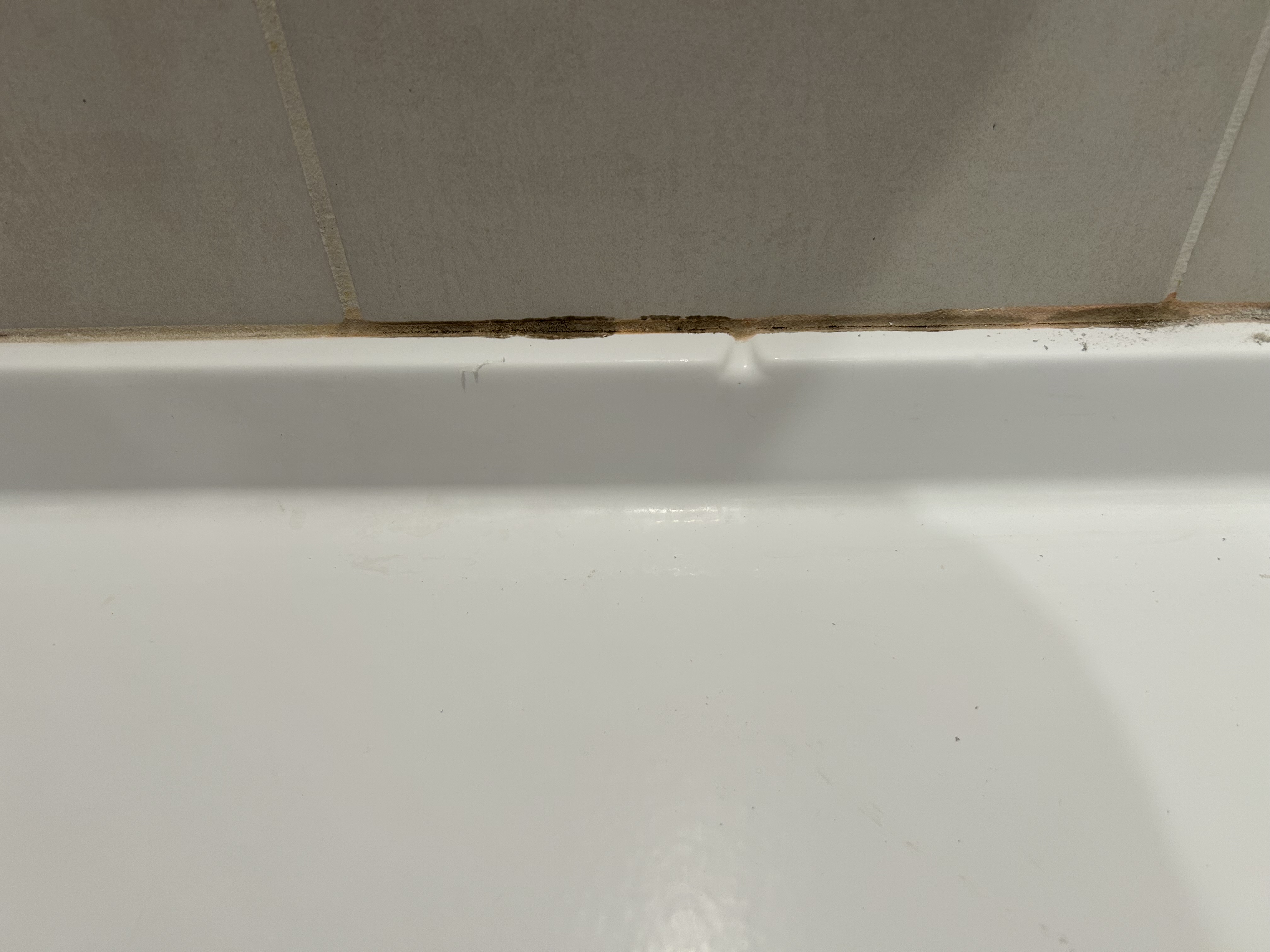 Caulking around shower pan