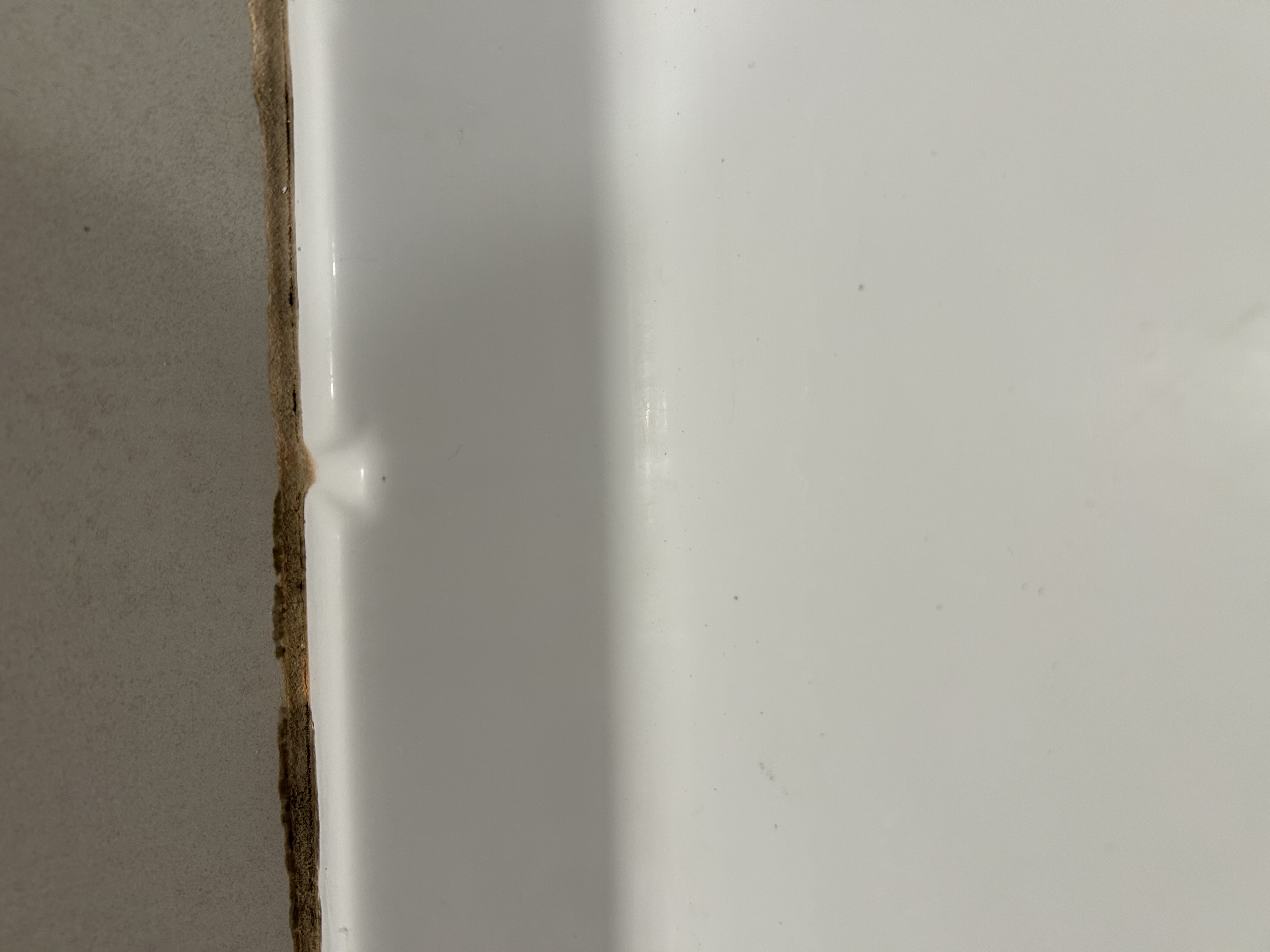 Caulking around shower pan