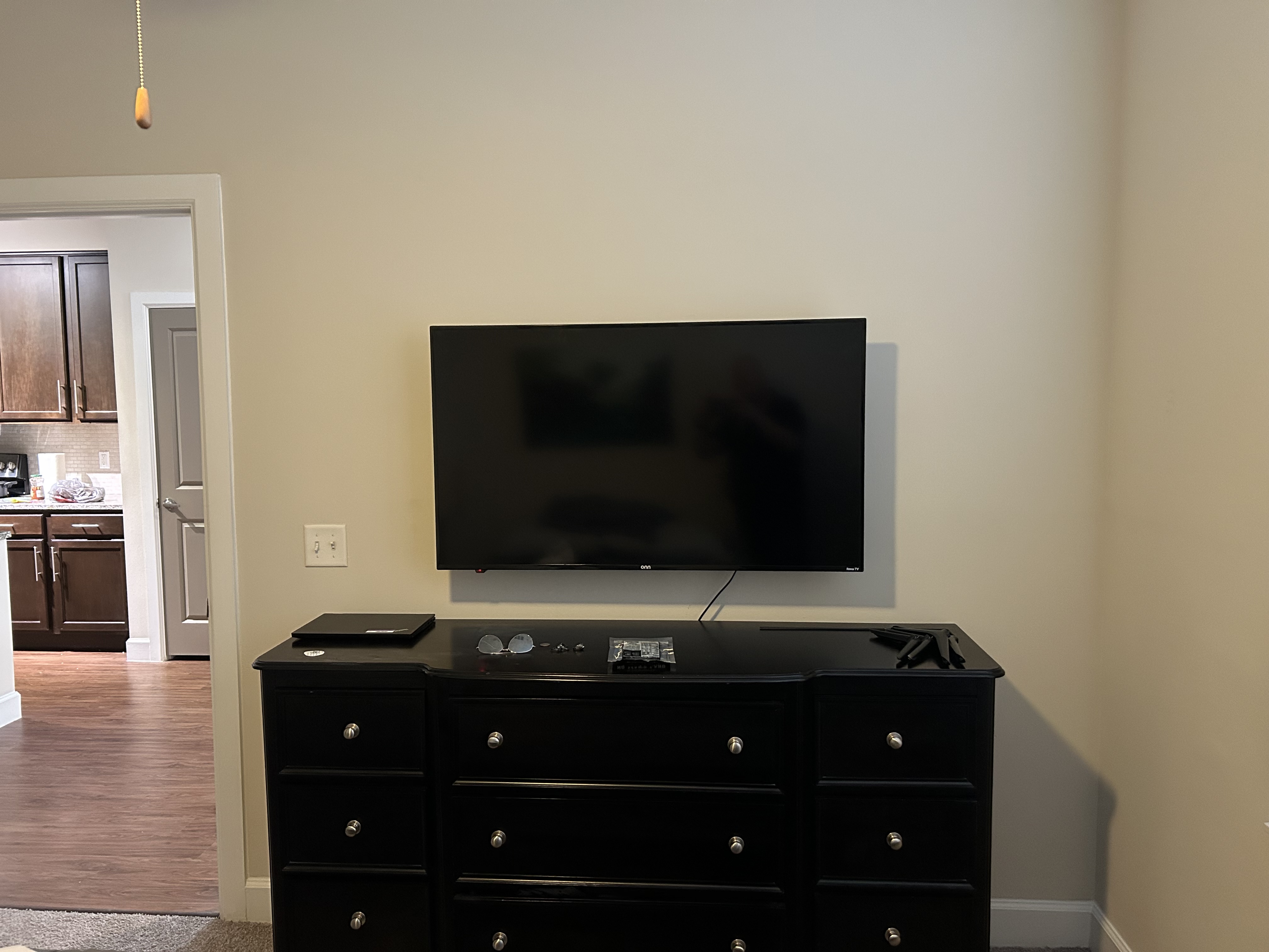 Bedroom TV mounted on wall
